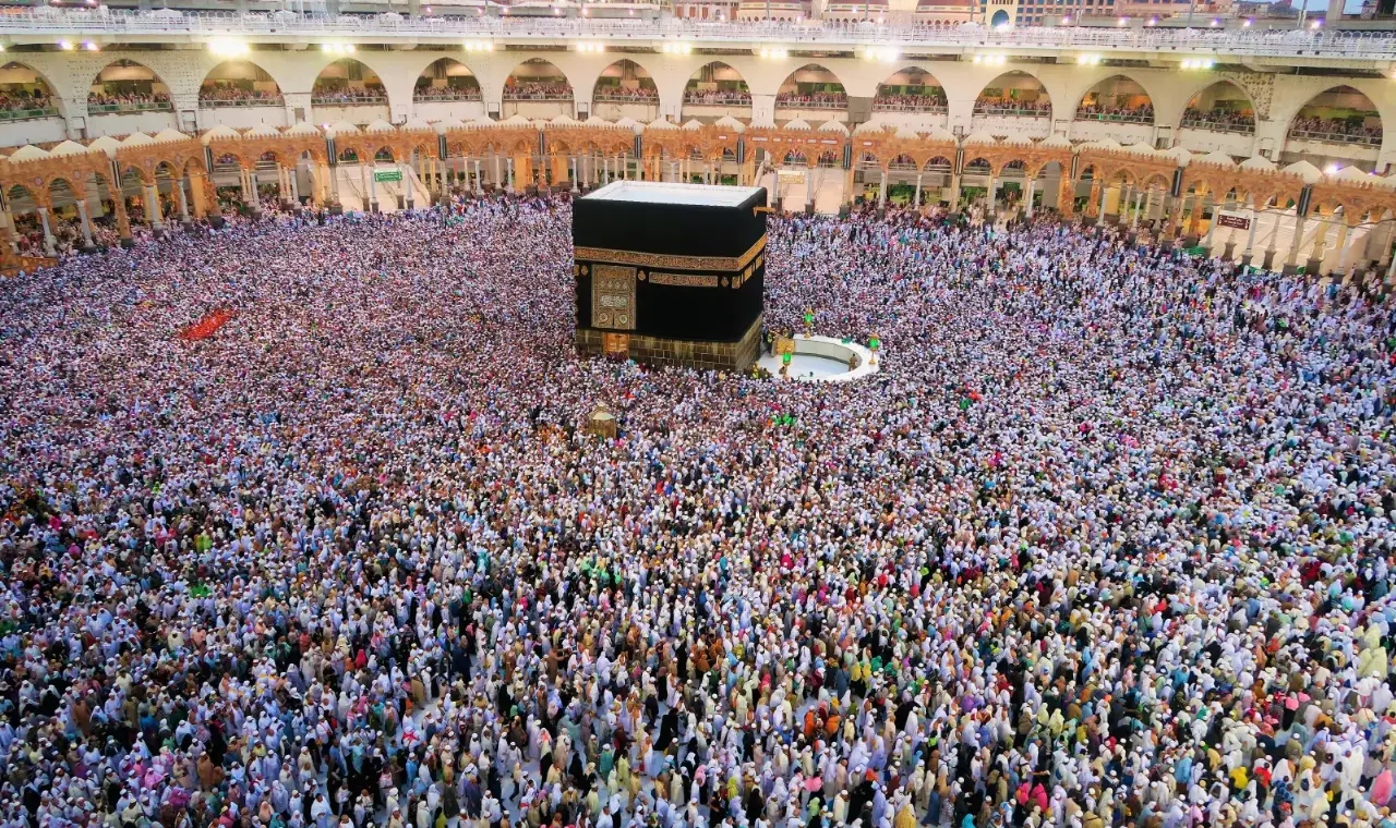 Pilgrims praying in the courtyard of Masjid al-Haram